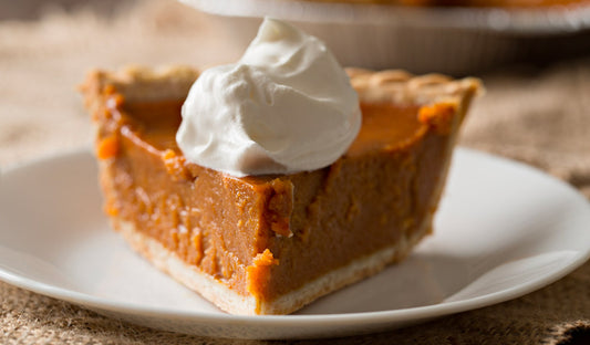 Slice of coconut milk pumpkin pie with anise seed crust