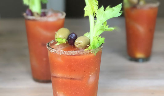 Spicy Bloody Mary with a smoked salt rim, lime and celery garnish