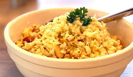 Riced cauliflower seasoned with za'atar and toasted sliced almonds