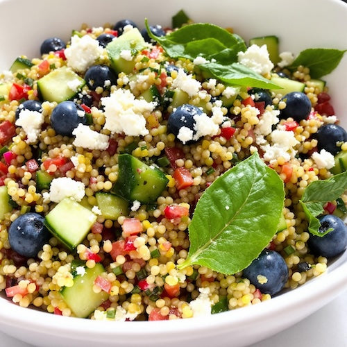 Quinoa salad with fresh blueberries, cucumber, and feta