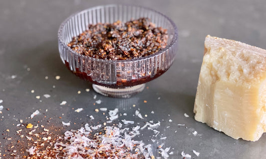 Dish of homemade red chili crisp with morita chiles and walnuts