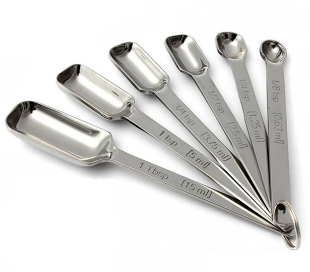 https://smithandtruslow.com/wp-content/uploads/2021/11/measuring-spoons-set-stainless-steel-fanned-up.jpg